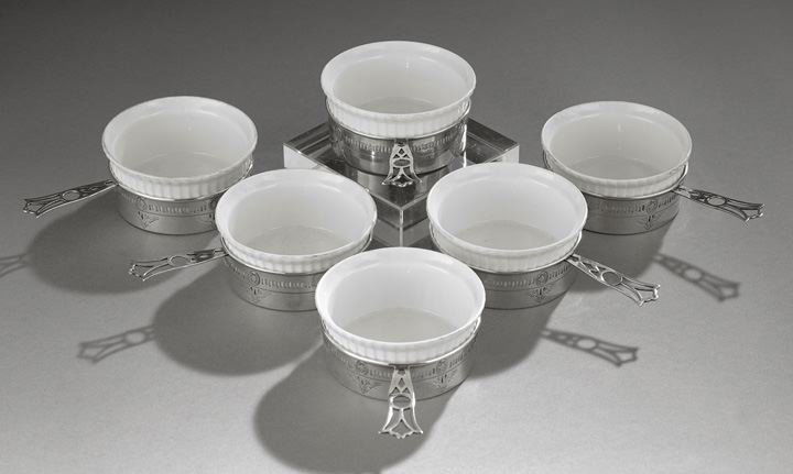 Set of Six Sterling Silver and Porcelain Ramekins: Set of Six Sterling Silver and Porcelain Ramekins, second quarter 20th century, the sterling frames by the Webster Co., North Attleboro, Massachusetts, the fired porcelain ramekins by Tressemanes & Vo