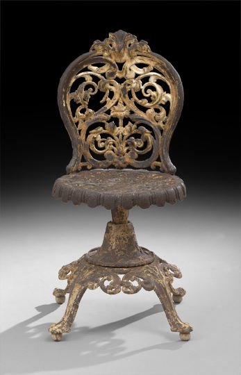 Anglo-American Cast-Iron Garden Stool: Anglo-American Cast-Iron Garden Stool, late 19th century, the corset-form back in open foliate and scroll decor, joined to a circular revolving seat, on a pedestal with pierced apron and four legs, h.