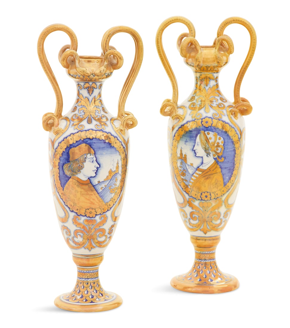 Pair of Italian Deruta Majolica Vases: Pair of Italian Deruta Majolica Vases ca. 1900, decorated with a cobalt and gold lustre, set with coiled serpent-molded handles, the facades with roundels painted with portraits of, respectively, a no