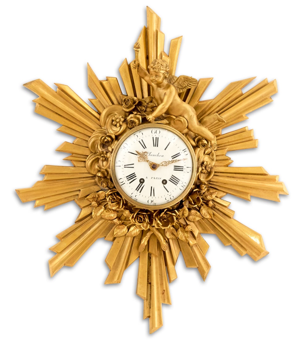 French Gilt-Bronze "Planchon" Cartel Clock: French Gilt-Bronze "Planchon" Cartel Sunburst Clock post-1914, in the Louis XV style, the dial with a cherub bearing a torch, ushering in the dawn, a border of roses and clouds encircling th