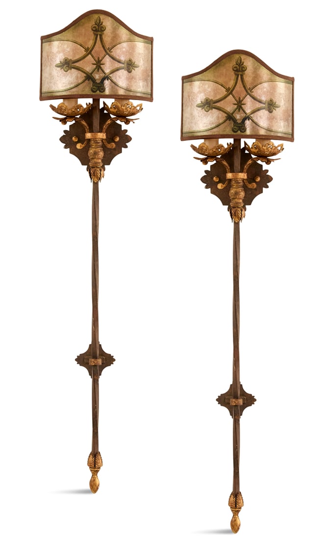 Pair of Patinated and Parcel-Gilt Metal Sconces: Pair of Patinated and Parcel-Gilt Metal Sconces in the baronial taste, each with a curved mica shade painted with fleurs-de-lis and set with a pair of faux candles mounted on pierced drip pans, suppor