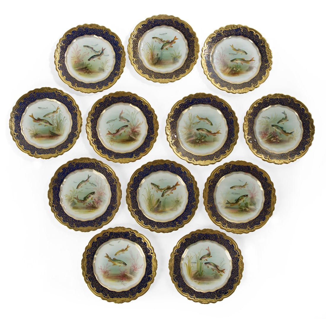 Set of Twelve English Bone China Fish Plates: Set of Twelve English Bone China Fish Plates fourth quarter 19th century, hand-painted and signed by William Birbeck on George Jones blanks, the reserve panels with aquatic plants and pairs of fish, t