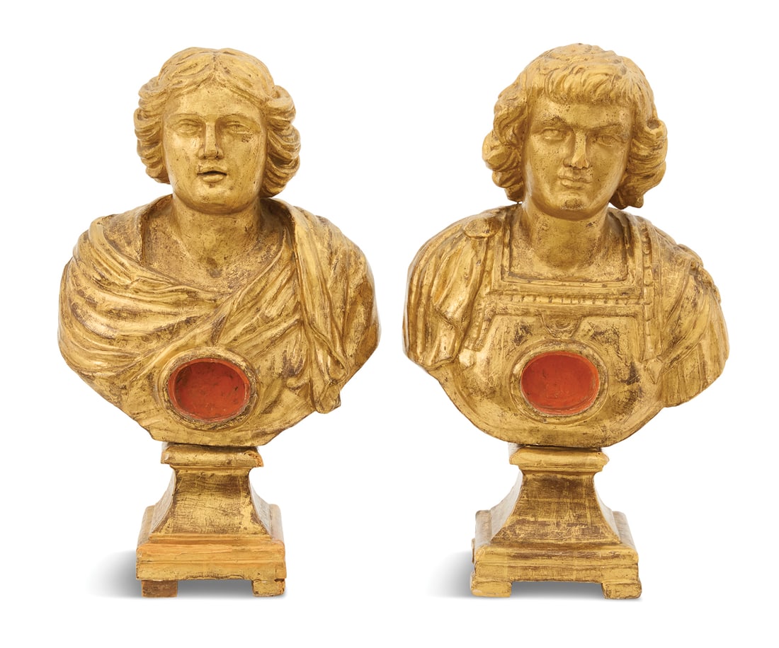 Pair of Carved Giltwood Reliquary Busts: Pair of Carved Giltwood Reliquary Bustsca. 1700, Italian or Spanish, one dressed in a cave breast plate and the other likely depicting St. Concordia, draped in robes, both on cove-carved socles.h. 20-