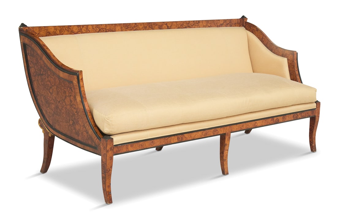 Faux Bois and Parcel-Ebonized Sofa: Faux Bois and Parcel-Ebonized Sofa20th century, in the Italian neoclassical taste, the frame presented in oyster burl graining, with a padded back and loose seat cushion, raised on down swept legs.h.