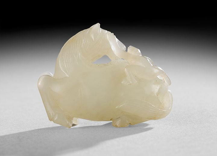 Chinese Jade Pendant: Chinese Jade Pendant, 18th century, carved in the form of a horse, monkey and bee for the rhebus "instantly become a high official", with good, even white color, l. 1-1/2".