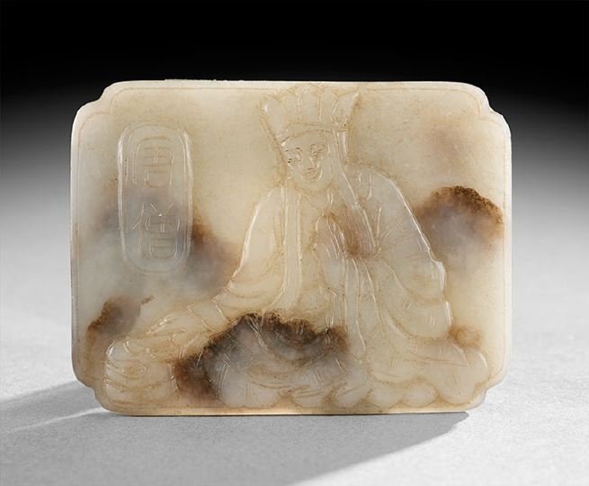 Chinese Jade Buckle: Chinese Jade Buckle, 18th century, rectangular form, carved in relief with a figure of a Buddhist priest, stone of a white color with brown cloud like areas, w. 2", l. 3".