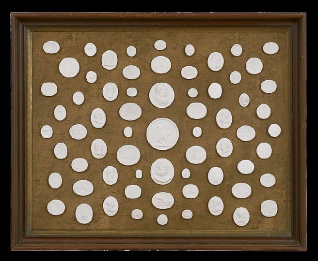 Shadowbox of Italian Plaster Grand Tour Cameos: Framed Shadowbox of Italian Plaster Grand Tour Cameos, third quarter 19th century, designed to illustrate tourist destinations and classical archeology, both obscure and famous, including the Three Gr