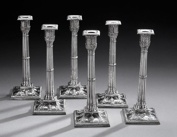Set of Six Edwardian Cluster Column Candlesticks: Set of Six Edwardian Cluster Column Candlesticks, first quarter 20th century, in the Georgian taste, each with a cluster columnar standard above a cavetto-domed square base decorated with urns and aca