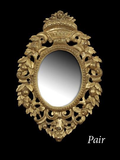 Pair of Louis XVI-Style Giltwood Mirrors: Pair of Louis XVI-Style Giltwood Mirrors, fourth quarter 19th century, the oval mirrors set with old mercury mirror plates, with a pierced border decorated with scrolls and fruit, the mirror plate bor