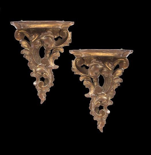 Pair of French Rococo-Style Wall Brackets: Pair of French Giltwood Rococo-Style Wall Brackets, made as a true pair, the backplates of pierced interlocking molded "C" scrolls, the shelves with molded edges and notched corners, h. 10", w. 8", d.