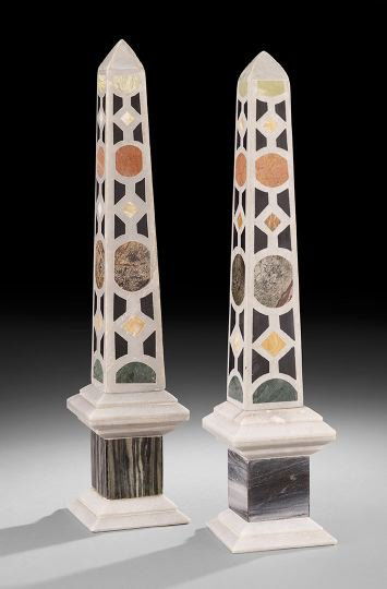 Pair of Pietra Dura Stone Obelisks: Pair of Pietra Dura Stone Obelisks, inlaid with onyx, malachite, rouge marble and various colored stones in bold, geometric patterns on all sided, raised on white granite bases supporting grey granite