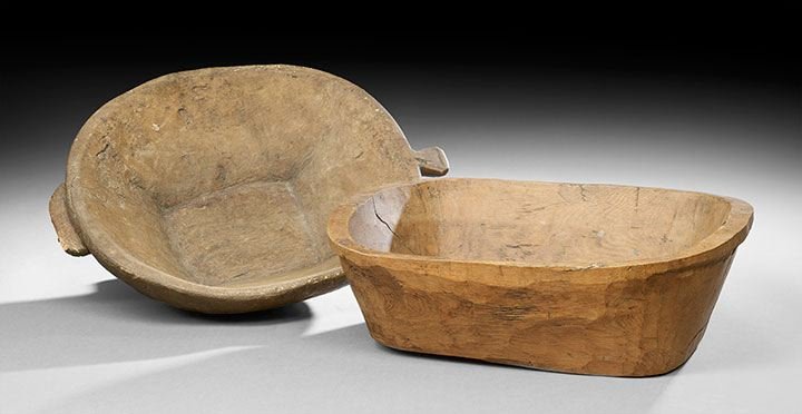 Two European Hewn Wooden Dough Bowls: Two European Hewn Wooden Dough Bowls, 19th century, the first example of pine, h. 6-1/2", d. 15-1/2", l. 20-1/2", and the second example in birch with one carved and one applied handle, h. 6-1/2", d.