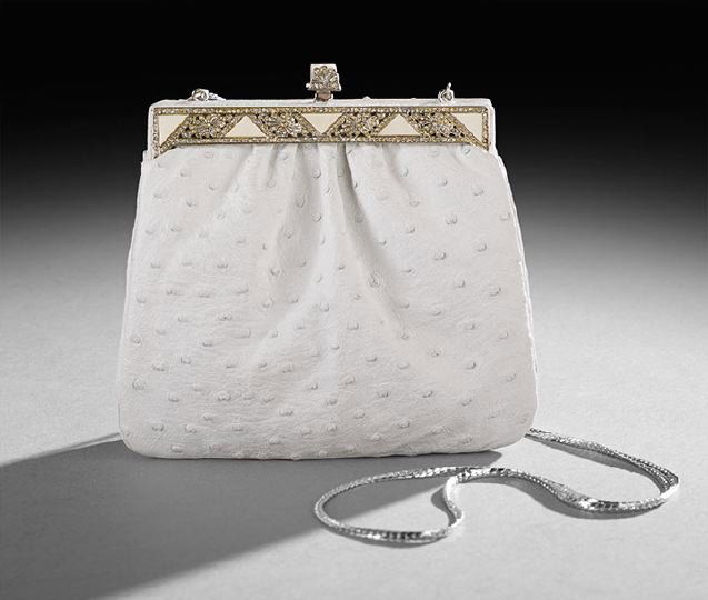 Judith Leiber White Ostrich Gusseted Evening Bag: Judith Leiber White Ostrich Gusseted Shoulder Evening Bag, 1979, the front gathered and topped with an ivory and cut-stone-inset silver frame and top closure, the ecru satin-lined interior with a scal