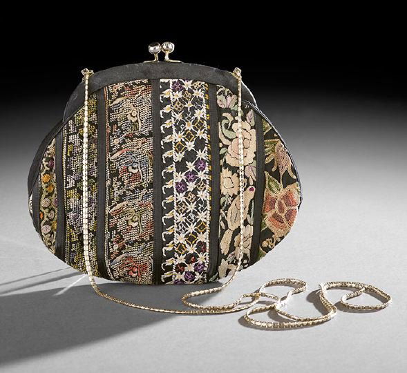 Vintage Judith Leiber Black Satin Shoulder Bag: Vintage Judith Leiber Black Satin and Patchwork Embroidery Shoulder Bag, 1974, the bag with various examples of embroidery separated by narrow vertical black satin bands, with a faceted onyx-set top c