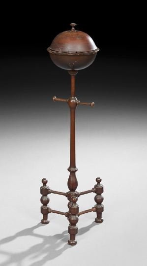 Mahogany String Holder: Mahogany String Holder, first quarter 20th century, probably American, the turned tripod base supports a vase-turned standard with a turned cross arm, the holder in the form of a spherical lidded bowl