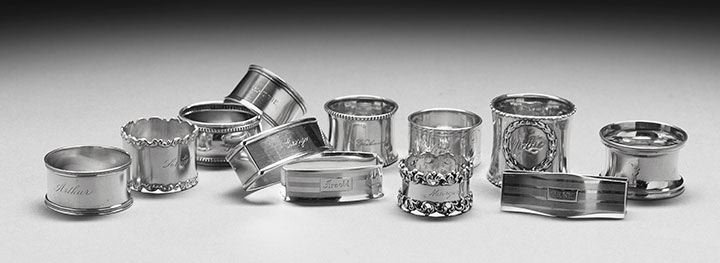 Twelve American Sterling Silver Napkin Rings: Collection of Twelve American Sterling Silver Napkin Rings, late 19th/early 20th century, including four Webster examples, one cylindrical with beaded rim, engraved "Arthur", h. 1", one convex rectang