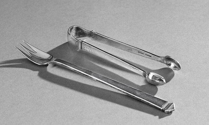 2 Pieces of Tiffany "Hampton" Sterling Flatware: Two Pieces of Tiffany & Co. "Hampton" Sterling Silver Flatware, the pattern designed in 1931 by Charles B. Blake, New York City, New York, including bow-style sugar tongs, l. 4", and a seafood/cocktai