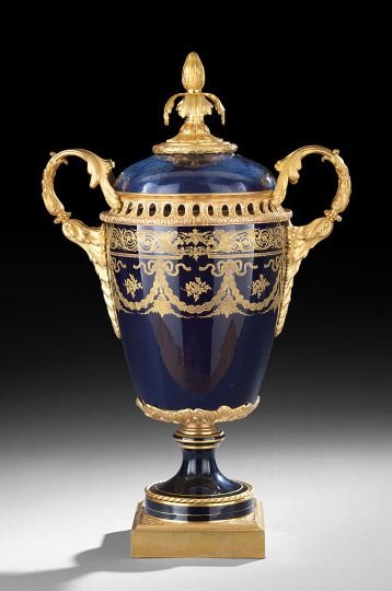 Cobalt Porcelain Urn with Gilt-Bronze Mounts: Imposing Cobalt Porcelain Garniture Urn with Gilt-Bronze Mounts, ca. 1900, French, raised on a square bronze plinth with leaf-molded corners, the round foot set with gilt-bronze rope twists, the base 