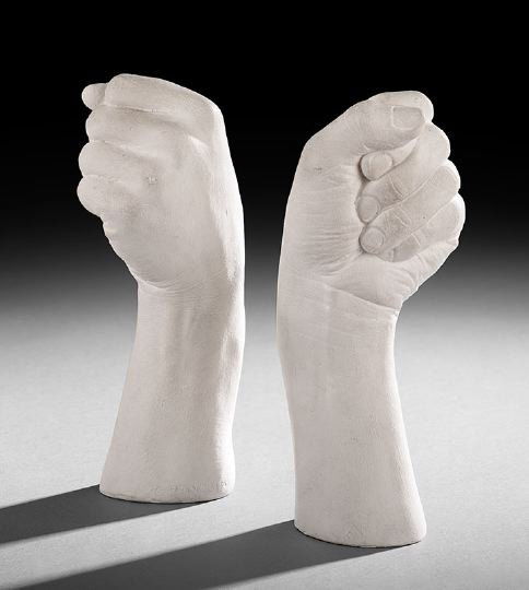 Richard Etts (American, b. 1976): Richard Etts (American, b. 1976), pair of figural plaster candlesticks, each formed in the shape of a fist, signed "copyright 1976 Richard Etts" on the lower edge, h. 10", w. 3-3/4", d. 3-1/4". Etts i
