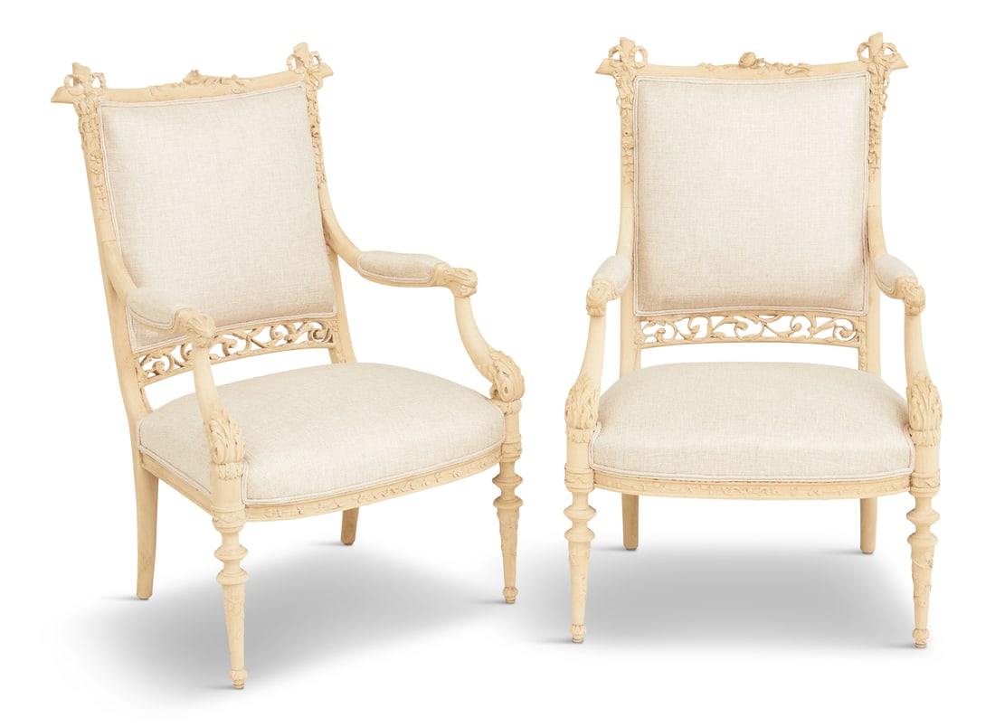 Louis XVI-Inspired Bleached Fruitwood Fauteuils: Pair of Louis XVI-Inspired Bleached Fruitwood Fauteuils20th century, each with a padded, square back surmounted by a floral crest and floral ribbon-entwined corners, with a foliate-pierced band below,