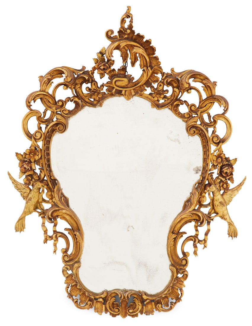 Giltwood Mirror in the Rococo Taste: Giltwood Mirror in the Rococo Taste early 20th century, the rocaille-carved surround set with scroll-carved piercing, accented with flower heads, and the sides decorated with phoenix birds, with ribbo