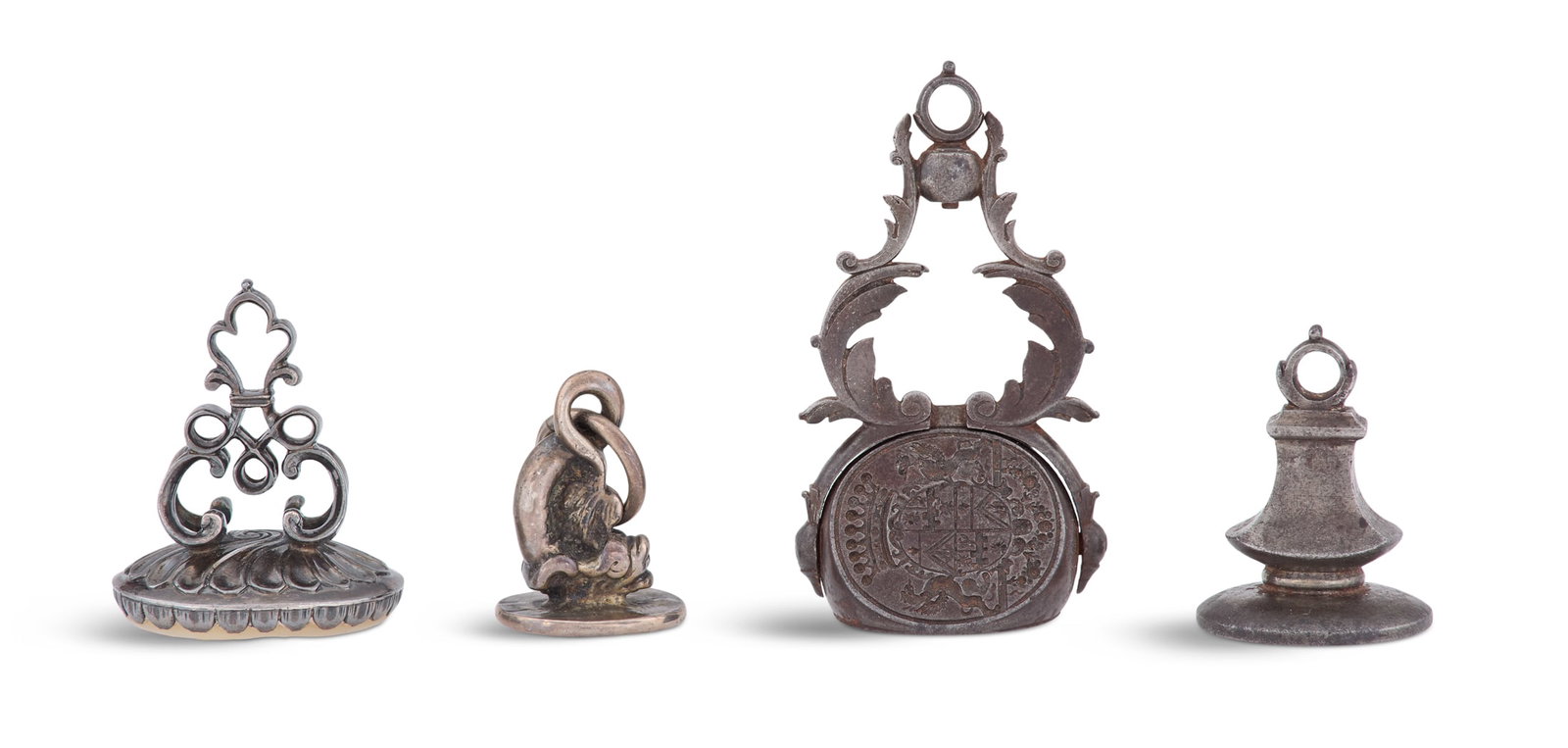 Four Fob Seals of the Van Kinschot Family: Four Dutch Steel and Silver Fob Seals of the Van Kinschot Family 17th/18th century, including: a silver example with figural dolphin standard and intaglio engraved with the arms of Gaspar Van Kinschot