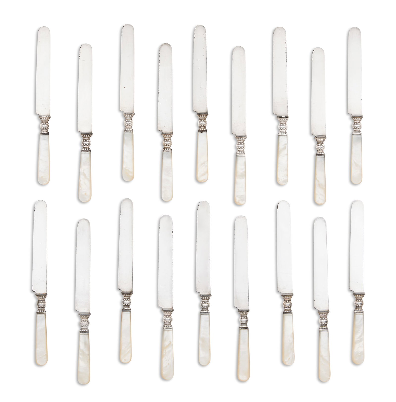 Eighteen New Orleans Close-Plate Dinner Knives: Set of Eighteen New Orleans Close-Plate Dinner Knives fourth quarter 19th century, Albert Baldwin & Co. Ltd., each with close-plate "blunt"-shaped steel blade, sterling baluster ferrule and 