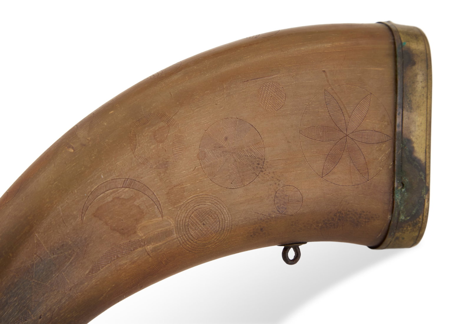 Flattened Powder Horn: Flattened Powder Horn etched with a knife on one side and a rifle on the other, all among circles, stars and crescents, with brass end cap, mechanical spout (detached but present) and strap rings. l. 