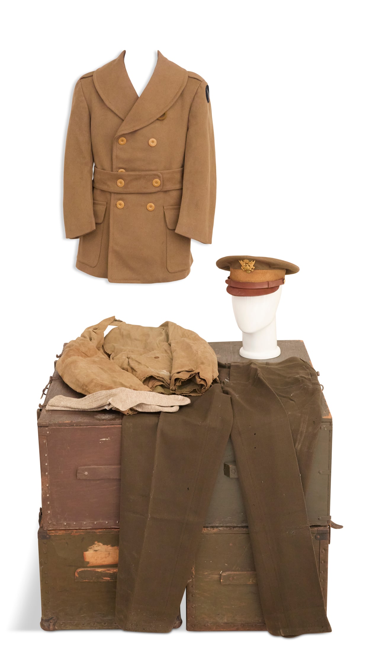 WWII Officer's Uniform: WWII Officer's Uniform assembled, including: a 1942 Army service cap (size 7-1/8), a M-41 field jacket, 1942 wool trousers (size 37), a M-1943 officer's short overcoat, and private purchase socks.