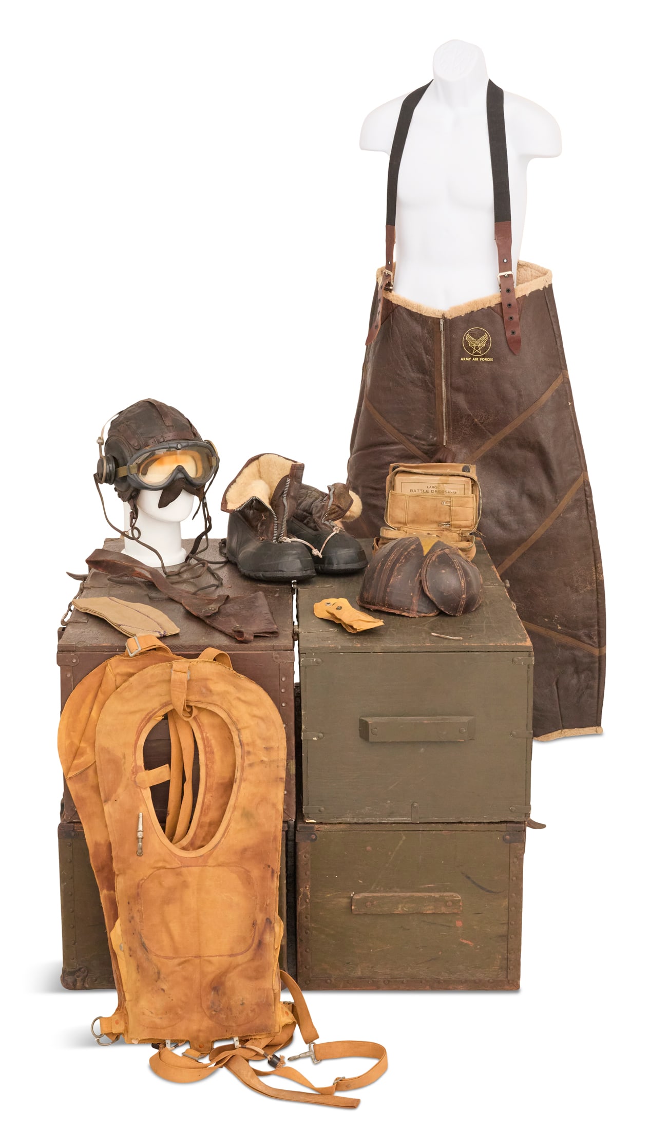 WWII Flight Gear: WWII Flight Gear including: A-6A winter flying shoes, an M-4A2 anti-flak helmet (one ear flap lacking), two "Mae West" life vests, a U.S. Aeronautics first aid kit, B-11 AAF leather aircraft
