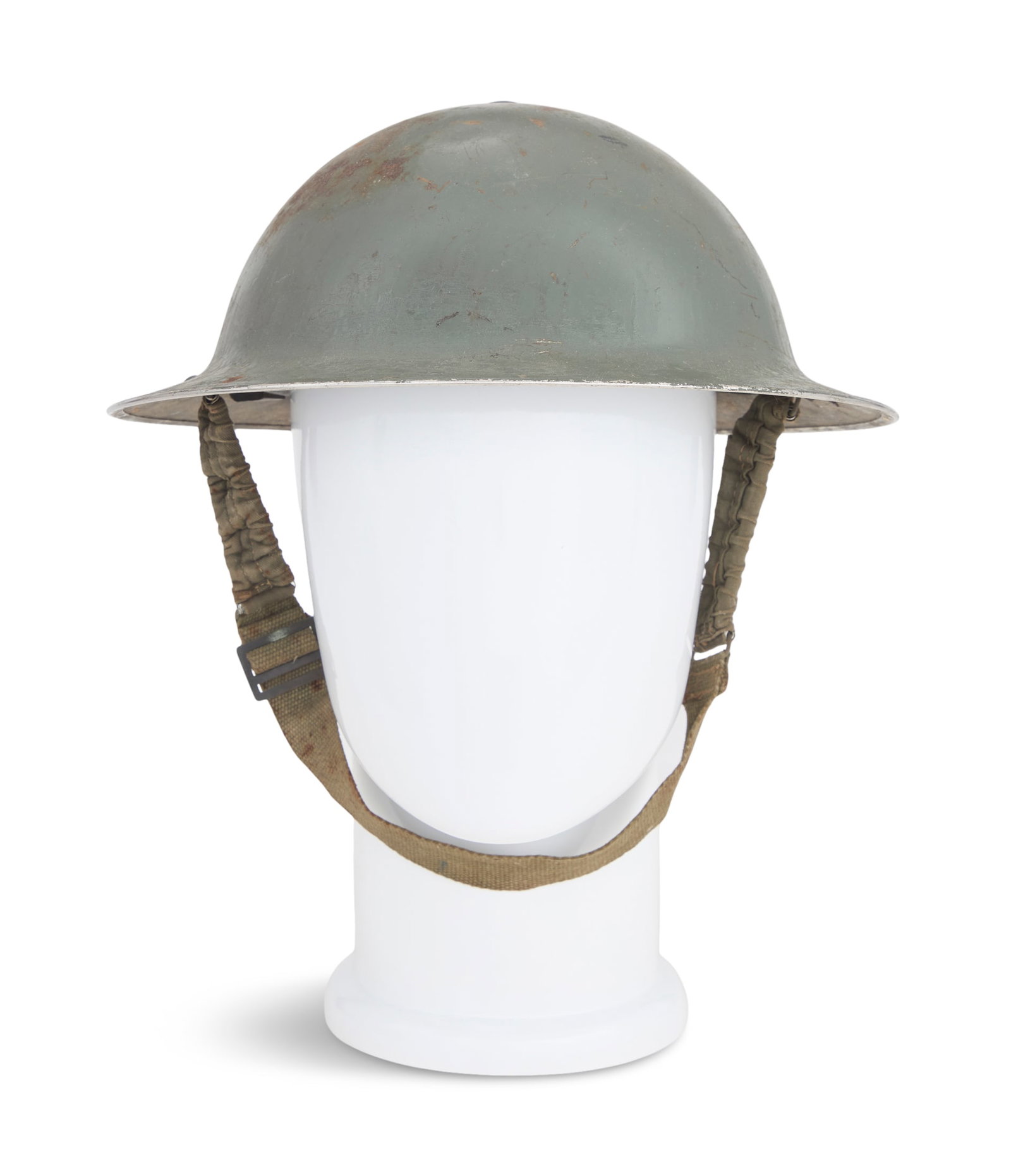 British WWII Steel Mark II Brodie Helmet: British WWII Steel Mark II Brodie Helmet 1938-1944, retaining the oilskin liner and canvas chin straps. h. 4-1/2", l. 12", w. 11-1/4"