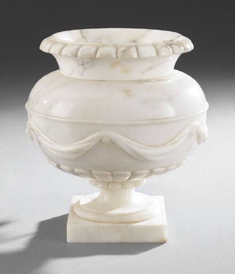 Italian Carved Alabaster Lamp: Italian Carved Alabaster Lamp, the bowl with carved swags and the interior with a single socket, h. 9".