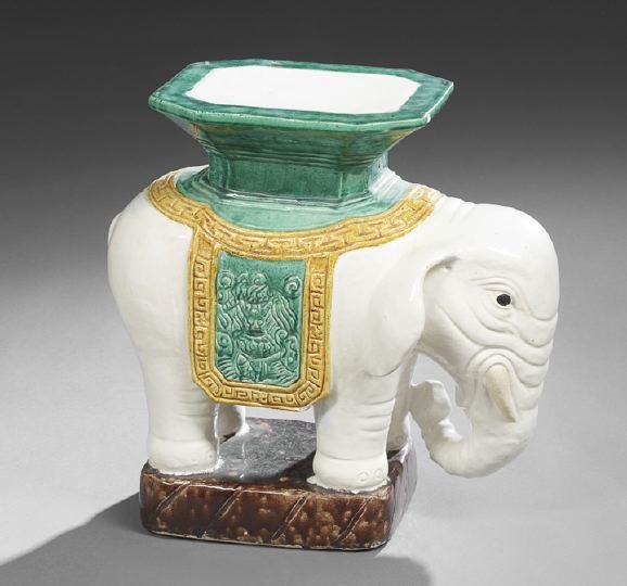 Chinese Porcelain Figural Garden Stool: Chinese Porcelain Figural Garden Stool, the seat in the form of a traditional saddle atop a standing elephant, h. 21-1/2", w. 22", d. 11-1/2".