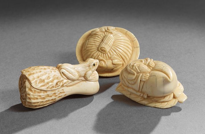 Group of Three Japanese Ivory Netsuke: Group of Three Japanese Ivory Netsuke, 20th century, the figures of a basket, a front with a cabbage plant and a warrior with a peach, l. 2".
