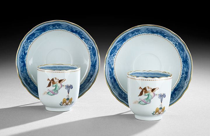 Pair of Mottahedeh Coffee Cups with Saucers: Pair of Mottahedeh Chinese Export Porcelain Coffee Cups with Saucers, made by Vista Allegre, bearing the arms of Cincinnati, with scalloped borders and blue-and-white borders incorporating moths, the 