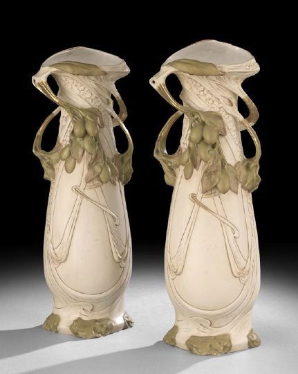 Pair of Art Nouveau Czechoslovakian Vases: Pair of Art Nouveau Czechoslovakian Vases, first quarter 20th century, made by Royal Dux and marked with a pink triangle pad mark, "Royal Dux Bohemia", the buff colored body, molded in swirling art no