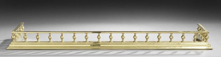Edwardian Brass Fire Fender: Edwardian Brass Fire Fender, having a molded base and spindled railing above, h. 4-1/4", d. 14", l. 51".