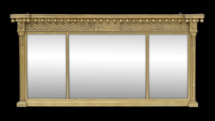 Regency-Style Giltwood Mantle Mirror: Regency-Style Giltwood Mantle Mirror, late 19th century, the tripartite rectangular plate surmounted by a molded cornice with drop ball finials over a lattice-patterned frieze centered by a drapery-ca