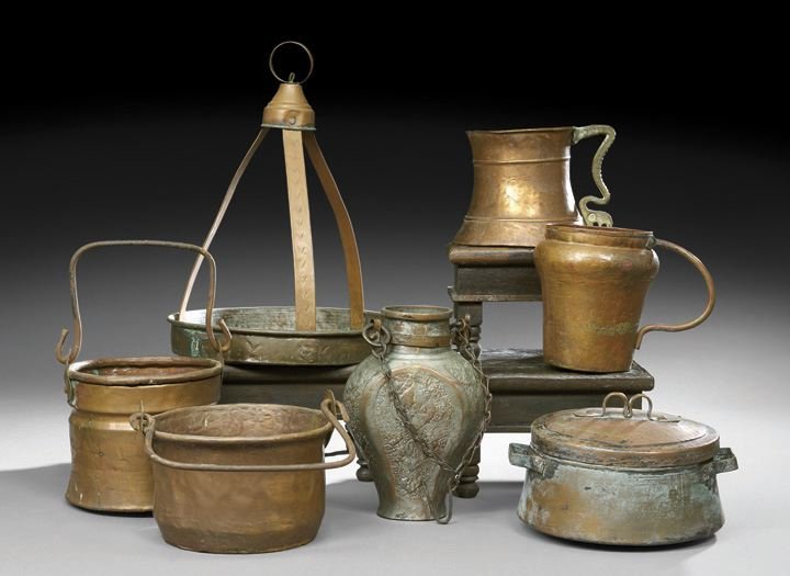 Group of Seven Middle Eastern Copper Vessels: Group of Seven Middle Eastern Copper Vessels, comprised of a vase-shaped water jug decorated heavily with repousse in patterns incorporating Moorish designs on all sides, the neck collar with rings at