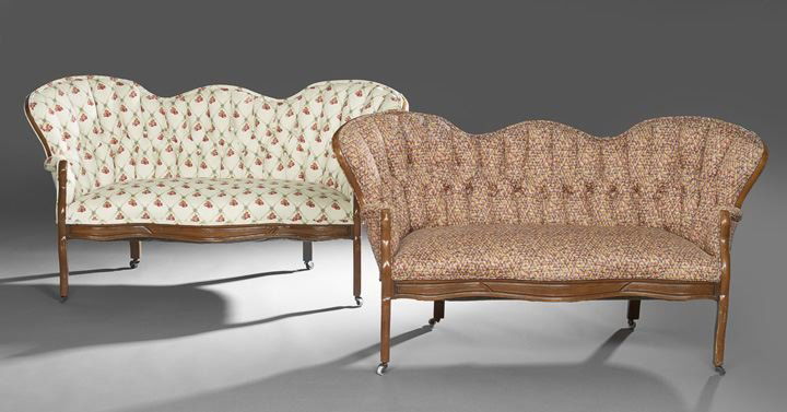 Two Diminutive Rococo Revival Walnut Settees: Two Diminutive Rococo Revival Walnut Settees, third quarter 19th century, with serpentine backs, seat rails and cabriole legs, h. 28", w. 53", d. 21".