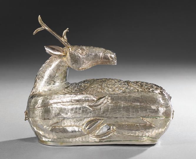 Cambodian Silverplate Betel Box: Cambodian Silverplate Betel Box, 20th century, in the form of a recumbent deer, with traditional repousse decoration, h. 6-3/4", l. 7-3/4", w. 4-1/2".