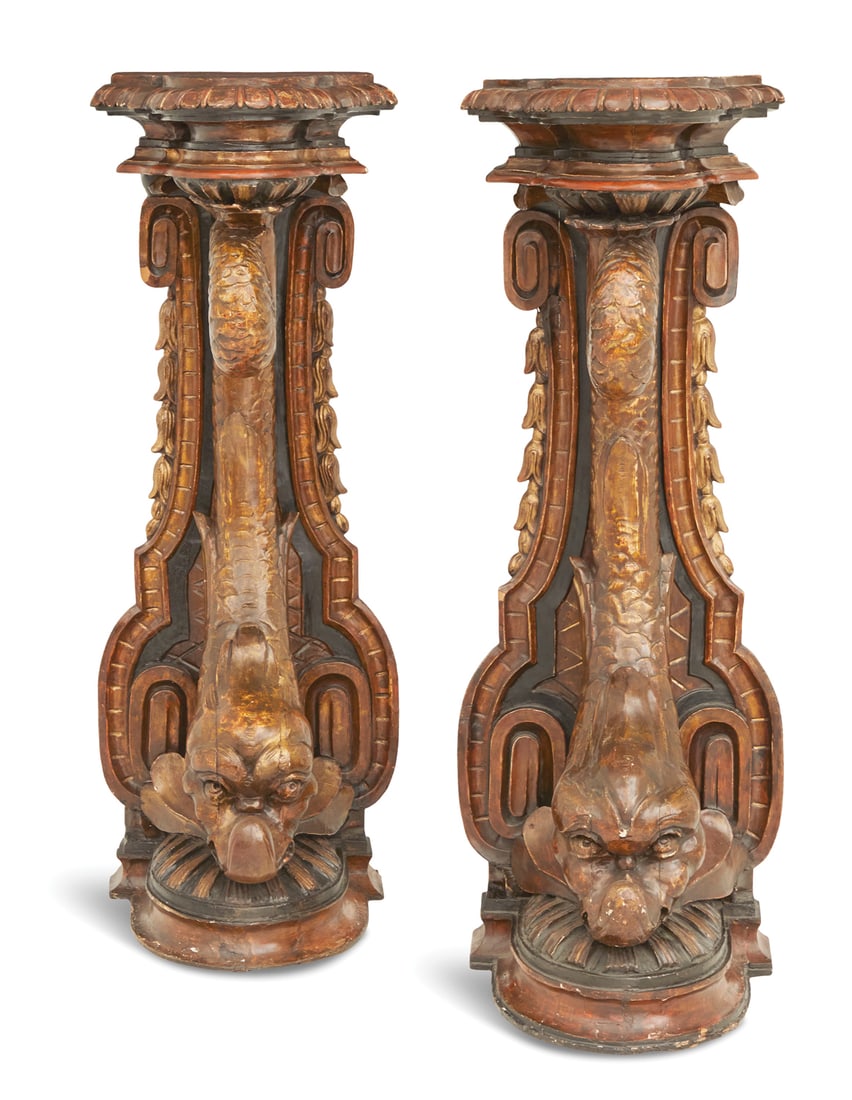 Pair of Large Venetian Parcel-Gilt Pedestals: Pair of Large Venetian Ebonized and Parcel-Gilt Pedestals 19th century, each with a demi-oval top above a heavily molded frieze, supported by a shaped back panel and a monumental carved dolphin suppor