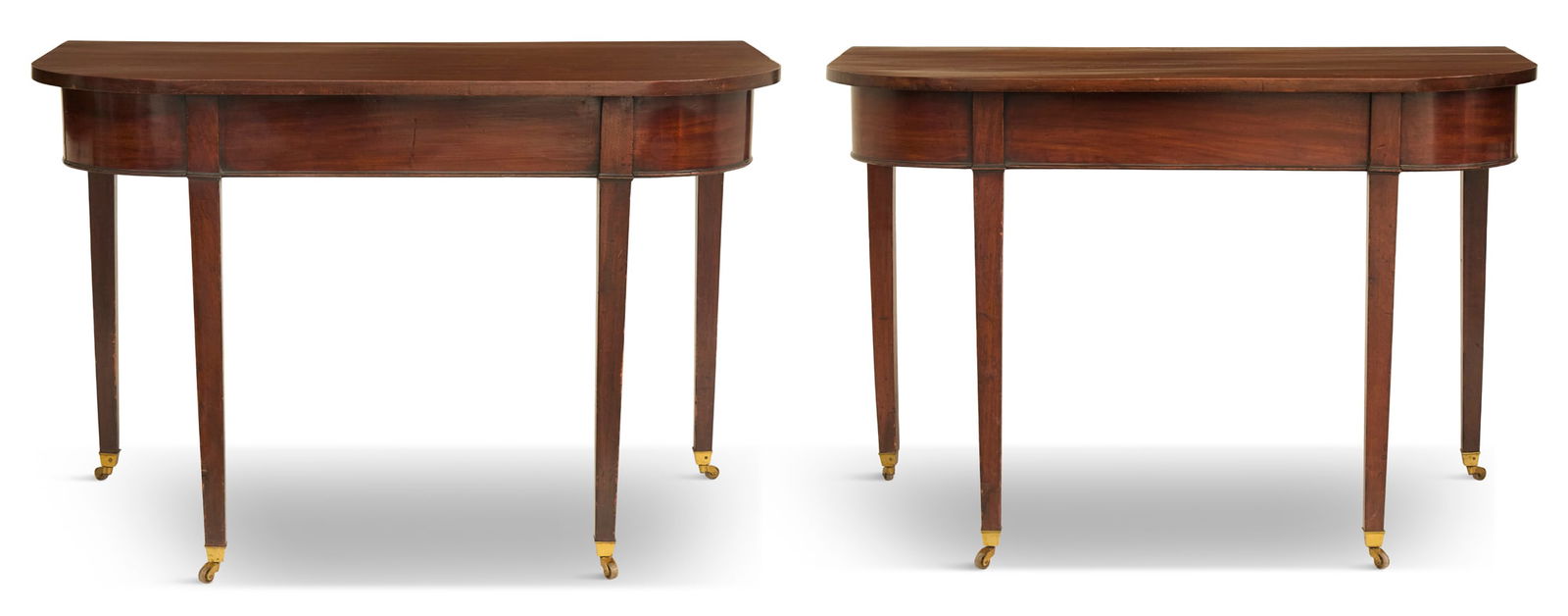 Pair of George III Mahogany D-End Console Tables: Pair of George III Mahogany D-End Console Tablesearly 18th century, each with a single-board top, mounted to a straight frieze apron and raised on tapered square legs, formerly two sections of a dinin