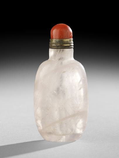 Chinese Pink Quartz Snuff Bottle: Chinese Pink Quartz Snuff Bottle, late 19th/early 20th century, the oval-shaped bottle with frosted bands throughout, well hollowed with a red coral top and brass spoon, h. 3-1/4.
