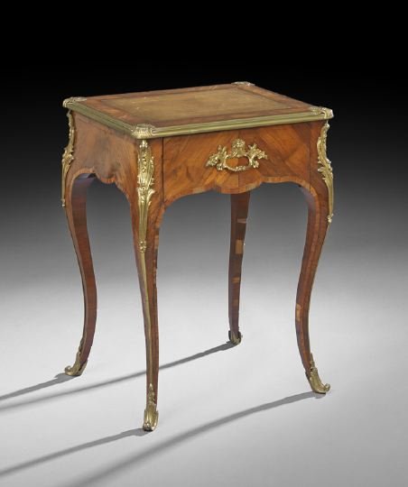 Louis XV-Style Kingwood Side Table: Louis XV-Style Kingwood Side Table, late 19th century, the rounded rectangular top with inset leather surface and corner ormolu mounts, above a frieze fitted with a single shaped drawer, raised on cab