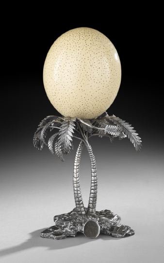 Elkington & Co. Ostrich Egg Centerpiece: Elkington & Co. Silverplate and Ostrich Egg Centerpiece, 1873, Birmingham, in the form of a pair of palm trees above a rocky crag, supporting an ostrich egg, h. 14".