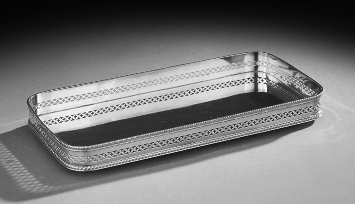Edwardian Silverplate Drinks Tray: Edwardian Silverplate Drinks Tray, first quarter 20th century, of rounded rectangular form with reticulated gallery and gadrooned and beaded edging, l. 12", w. 6".