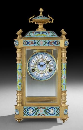 French Champleve Enamel Mantel Clock: French Champleve Enamel Mantel Clock, first quarter 20th century, the leaf-molded feet support the base, decorated with turquoise ground enamel panels, canted corners set with matching enamel colonett