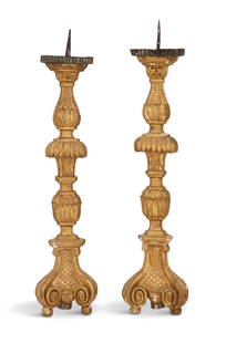 Pair of Italian Altar Sticks: Near Pair of Italian Wooden Altar Sticks first quarter 19th century, with remnants of silver gilding, on scrolled feet, with carved urns in the standards, and set with gilt tole pricket candle