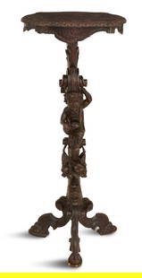Italian Carved Hardwood Figural Pedestal: Italian Carved Hardwood Figural Pedestal late 19th century, the serpentine top carved with flowers and scrolls, with a fluted edge and a rocaille-carved skirt, the standard with a robustly curved